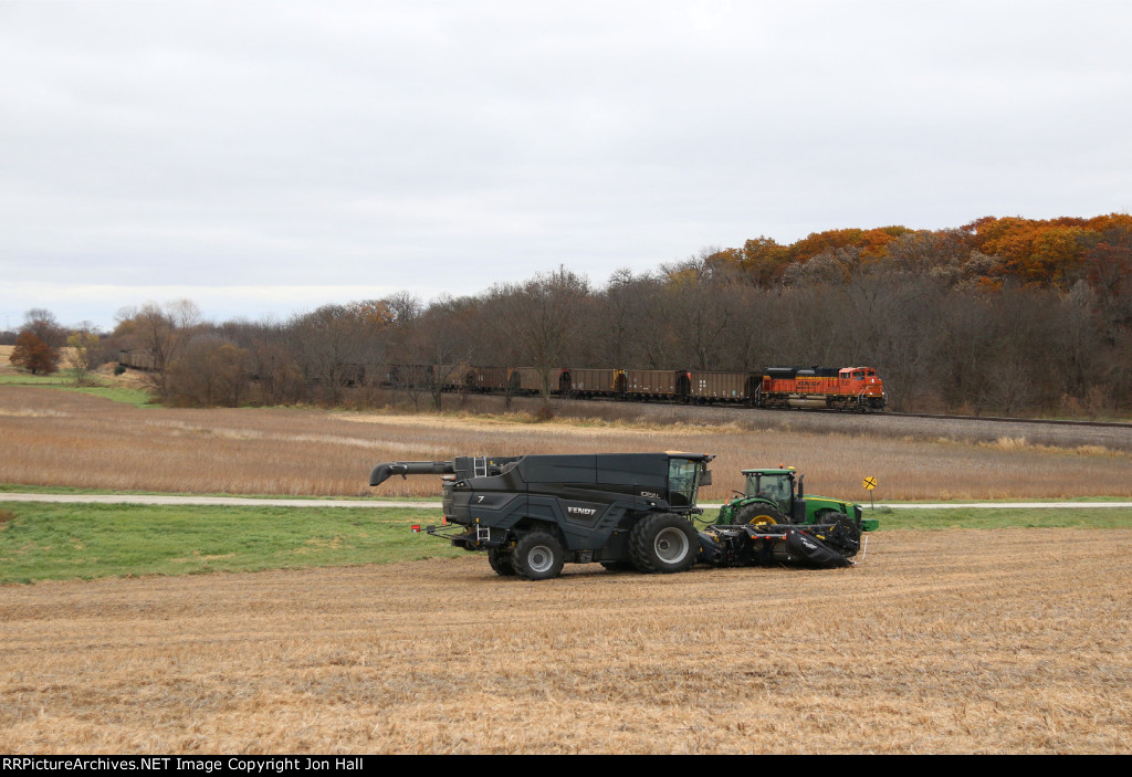 BNSF 8567 comes out of the trees heading west on the Ottumwa Sub with TVA coal empties